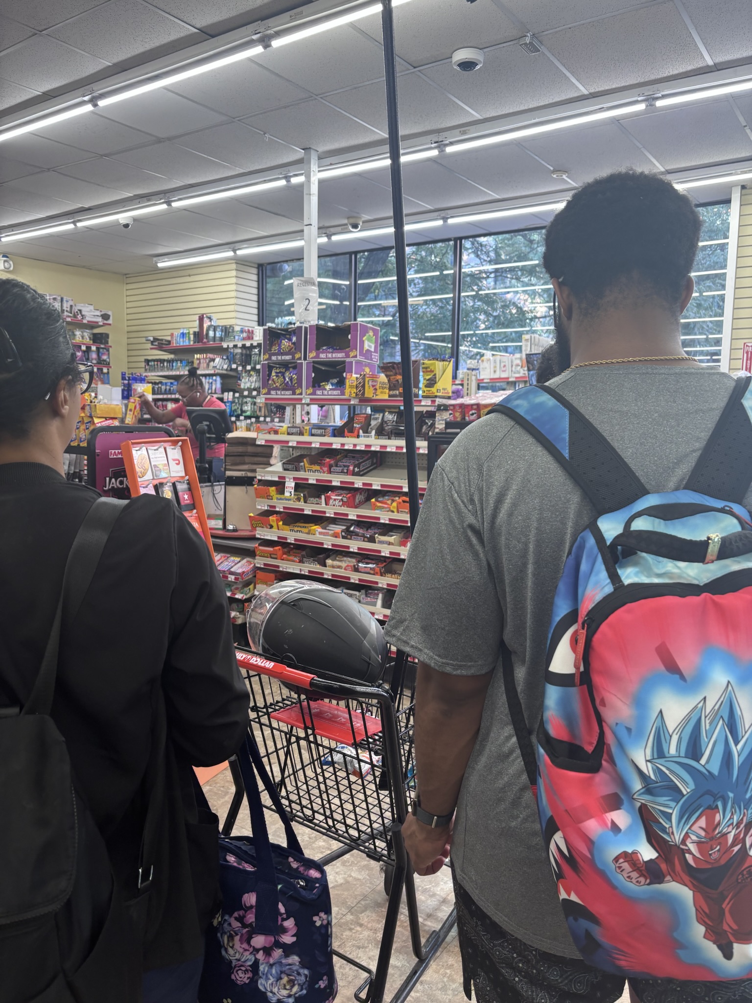 in line at family dollar to purchase a broom