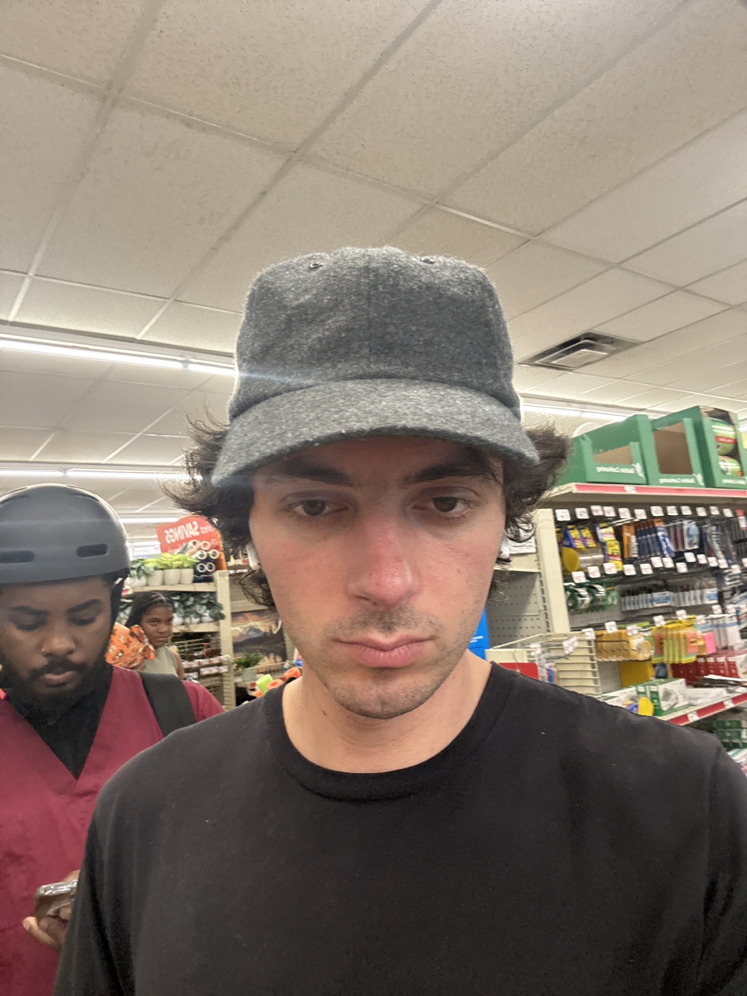 in line at family dollar to purchase a broom
